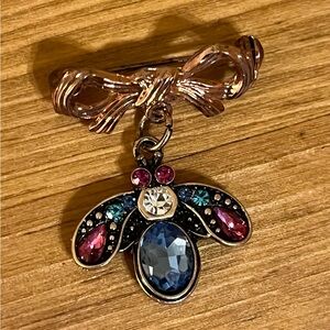 Flying bug with blue, pink, clear rhinestones that dangles on copper bow 1 1/2 “